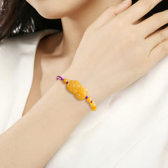 Golden Silk Jade PiXiu Wealth Bracelet – model wearing on wrist lifestyle, women fortune luck gift