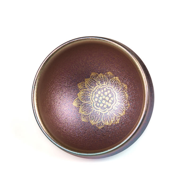 Jianzhan Lotus Tea Cup – brown iridescent oil-spot glaze with gold lotus center, white background, teaware