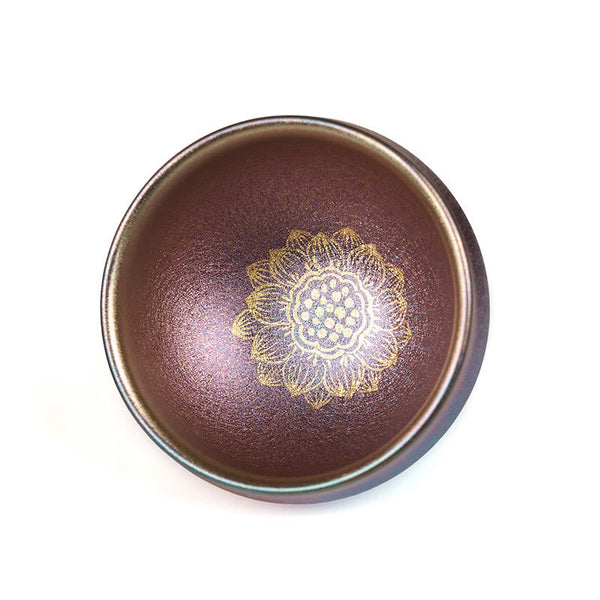 Jianzhan Lotus Tea Cup – brown iridescent oil-spot glaze with gold lotus center, white background, teaware