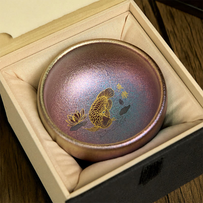 Jianzhan Koi Fish Lotus Teacup – interior gold koi fish detail, iridescent purple center, lotus flower, close-up macro