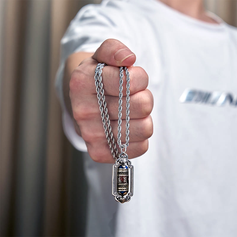 Om Mani Padme Hum Prayer Wheel Pendant – Handheld close-up revealing mantra inscription on gold-toned central band, spirit...