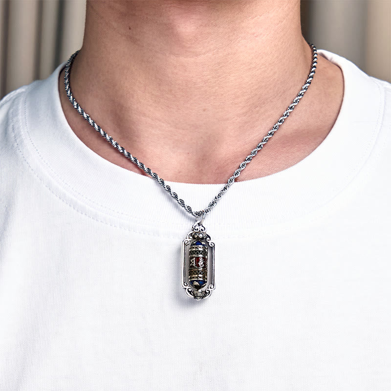 Om Mani Padme Hum Prayer Wheel Pendant – Held in hand providing size reference, thick rope chain draped over fingers, copp...