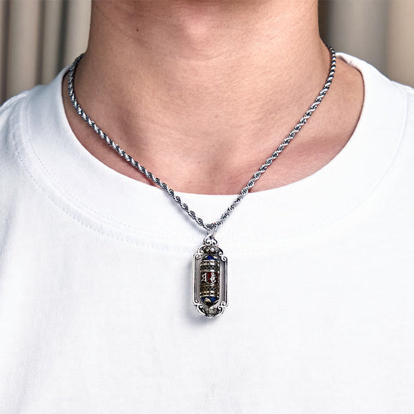 Om Mani Padme Hum Prayer Wheel Pendant – Held in hand providing size reference, thick rope chain draped over fingers, copp...