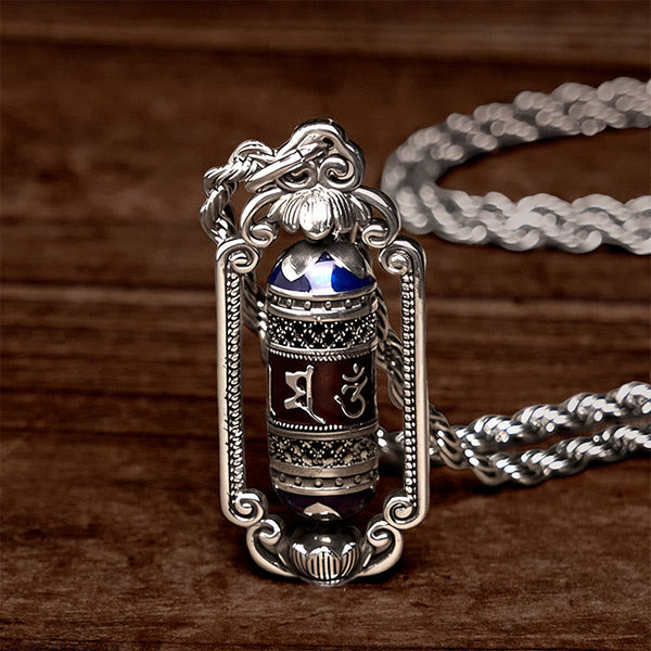 Om Mani Padme Hum Prayer Wheel Pendant – Worn on model with white t-shirt, demonstrating natural drape and pendant size on...