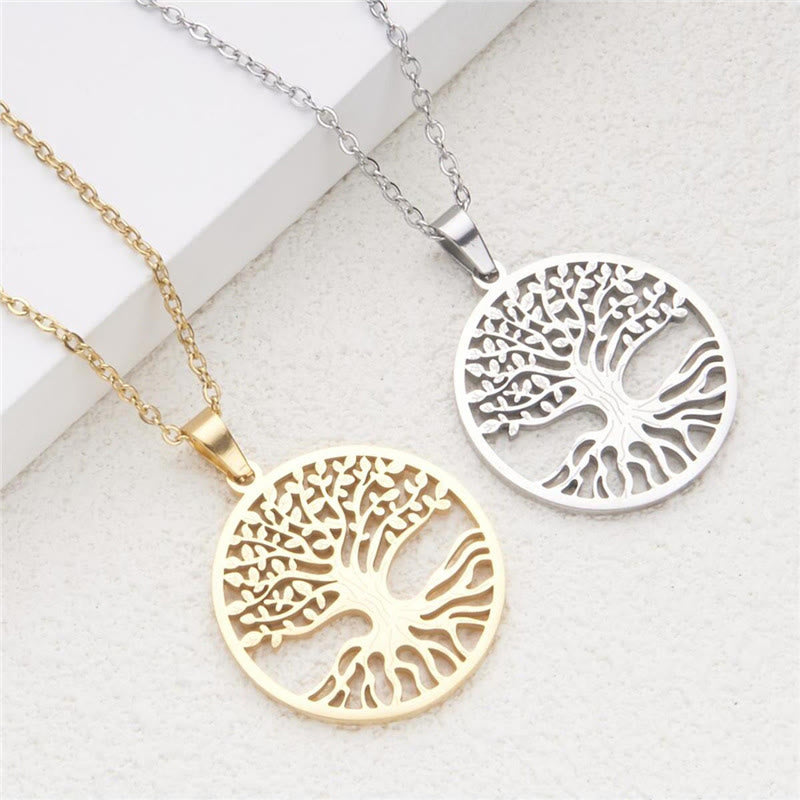 Tree of Life Titanium Steel Necklace – gold and silver pendants on gray stone, elevated dual-color view
