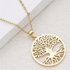 Tree of Life Titanium Steel Necklace – gold pendant on textured stone surface, elevated diagonal photo