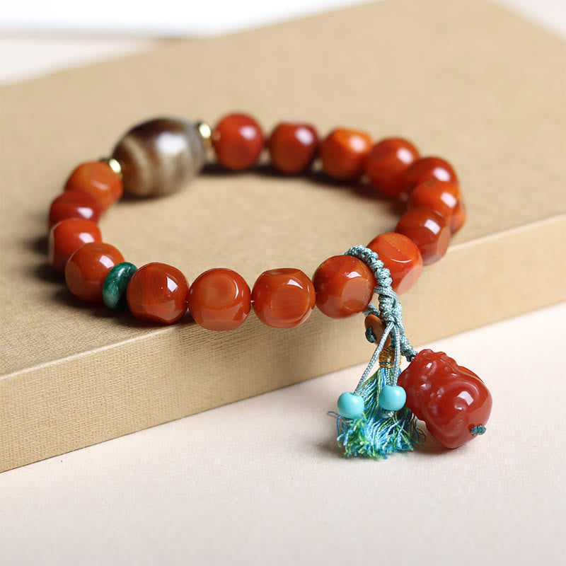 South Red Agate Dzi Bead PiXiu Bracelet – alternate side on cream box, PiXiu fortune charm