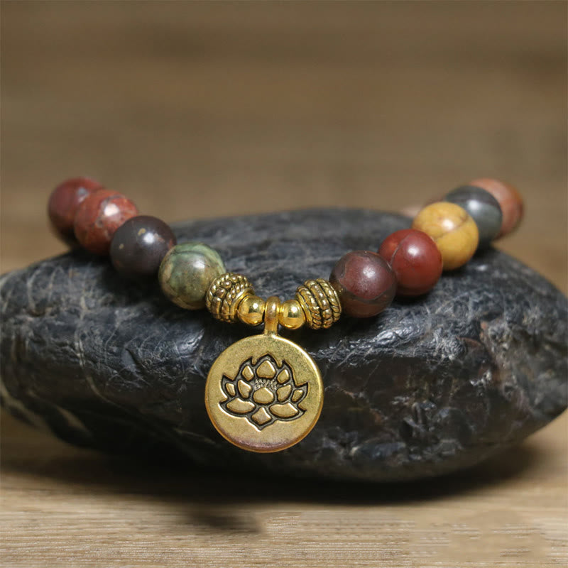 Boho stretch bracelet with earthy stone beads and gold lotus charm