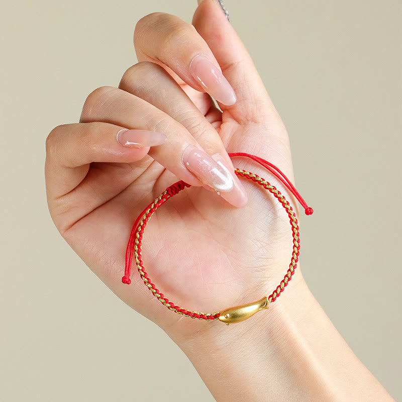 999 Sterling Silver Koi Fish Rope Bracelet – red gold cord held in hand, macro charm detail