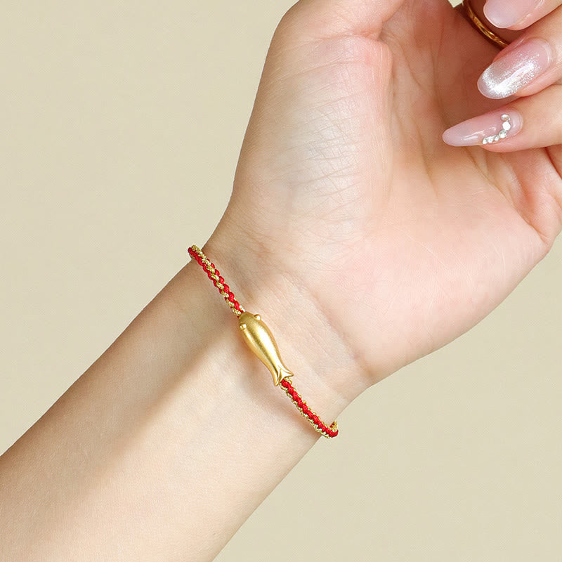 999 Sterling Silver Koi Fish Rope Bracelet – red cord on wrist, manicured hand, worn look