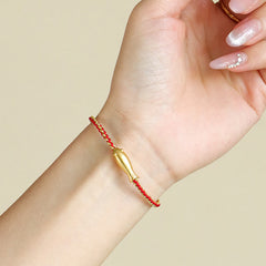 999 Sterling Silver Koi Fish Rope Bracelet – red cord on wrist, manicured hand, worn look