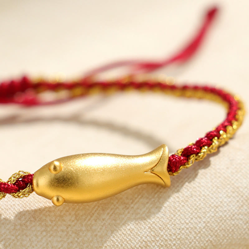 999 Sterling Silver Koi Fish Rope Bracelet – red gold cord macro, diagonal on linen surface