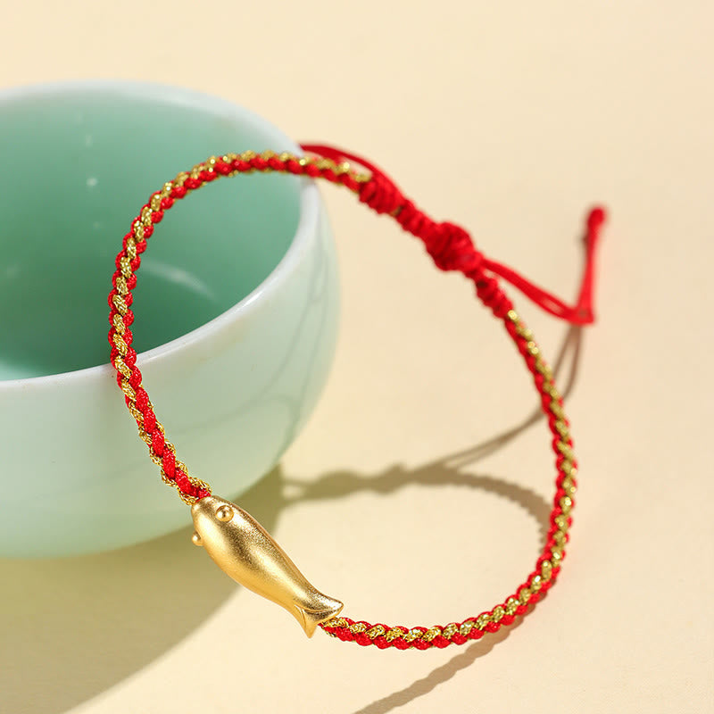 999 Sterling Silver Koi Fish Rope Bracelet – dark red cord with koi on celadon ceramic cup
