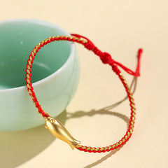 999 Sterling Silver Koi Fish Rope Bracelet – dark red cord with koi on celadon ceramic cup