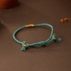 Copper Lucky Koi Fish Rope Bracelet – close-up teal braided cord with gold beads, luck amulet