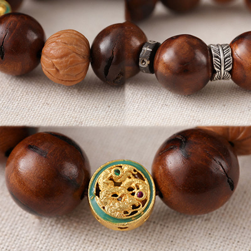 Tibet Jujube Wood Yin Yang Bracelet – split detail shot showing carved wood bead texture and gold filigree focal bead with...