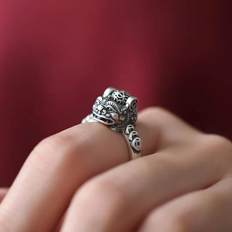 Copper Coin Pixiu Feng Shui Ring – finger side angle red background detailed pixiu carving, good fortune