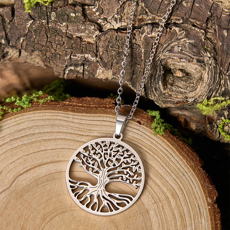 Tree of Life Titanium Steel Necklace – silver pendant on tree cross-section with bark, three-quarter view