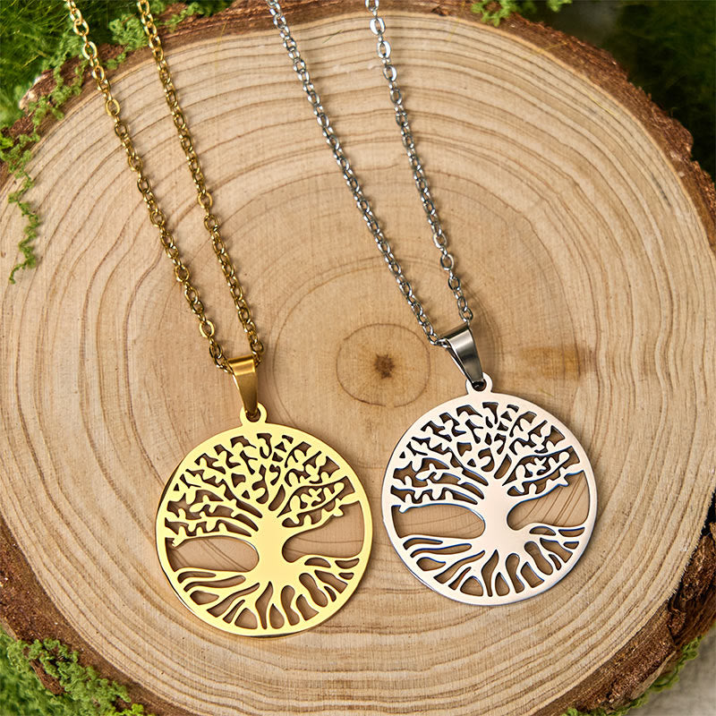 Tree of Life Titanium Steel Necklace – gold and silver necklaces on log slice with moss, flat lay compare