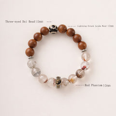 Lightning Struck Wood Red Phantom Bracelet – flat lay on white background showing jujube wood dzi bead and red phantom qua...
