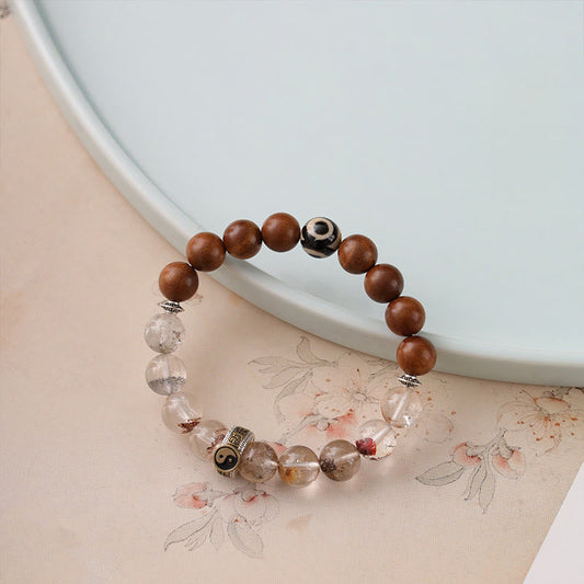 Lightning Struck Wood Red Phantom Bracelet – beaded bracelet with wooden and phantom quartz beads on peach floral backgrou...