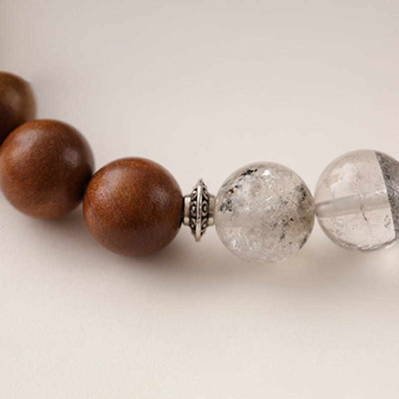 Lightning Struck Wood Red Phantom Bracelet – macro detail of translucent phantom quartz beads with reddish mineral inclusi...
