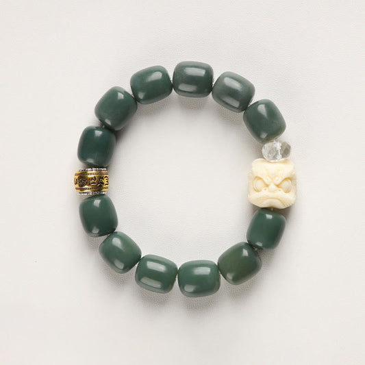 Bodhi Seed Lion Head Om Mani Padme Hum Bracelet - flat lay showing carved guardian lion bead, zen bracelet