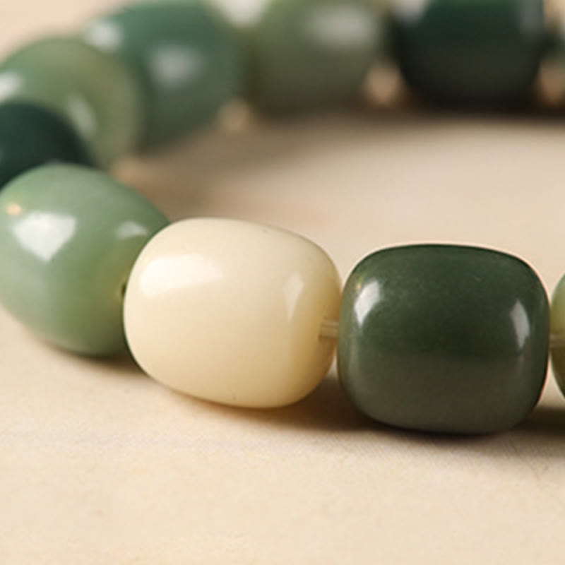 Bodhi Seed Lion Head Om Mani Padme Hum Bracelet - polished green beads with ivory accent, natural bead mala