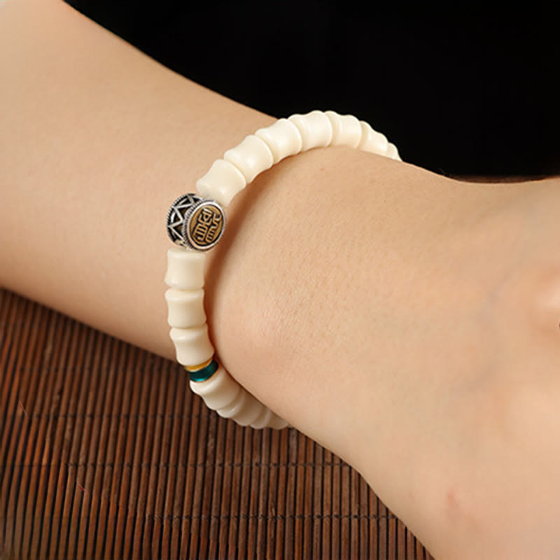 Bodhi Seed Dragon Pattern Bracelet – worn on wrist with engraved metal bead on bamboo, Mindfulness