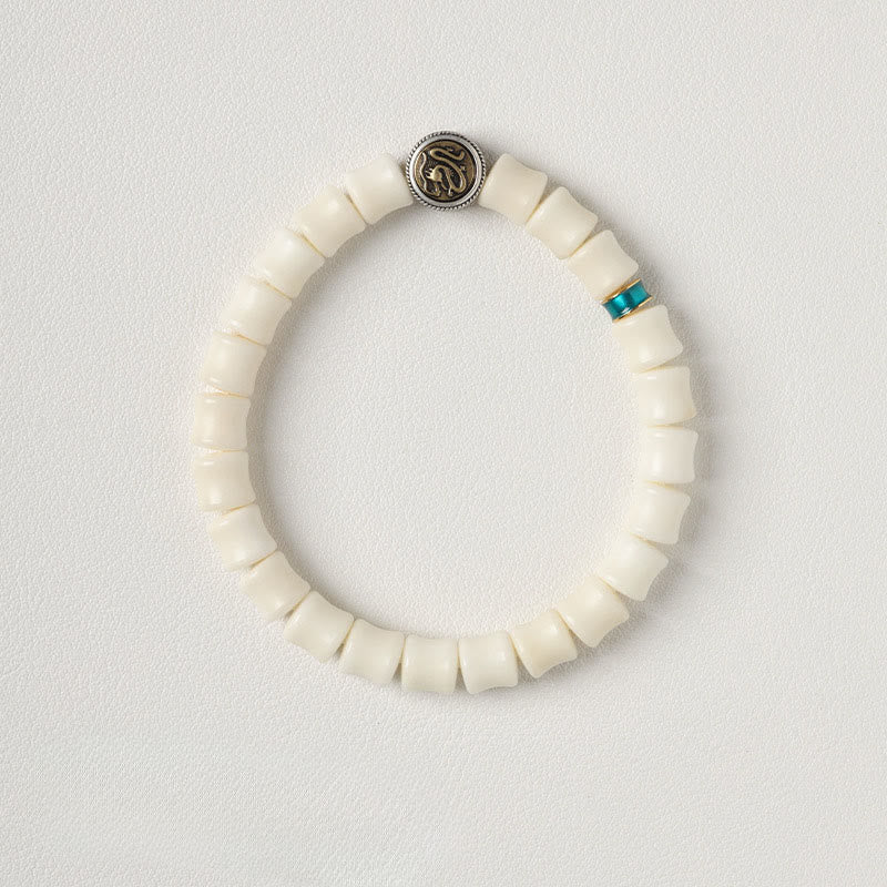 Bodhi Seed Dragon Pattern Bracelet – top-down ivory beads with turquoise spacer and silver medallion, Spiritual