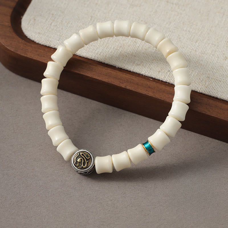 Bodhi Seed Dragon Pattern Bracelet – three-quarter view with bone beads turquoise and medallion, Protection
