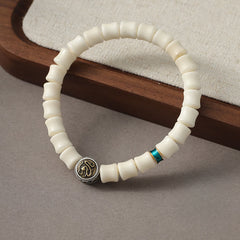 Bodhi Seed Dragon Pattern Bracelet – three-quarter view with bone beads turquoise and medallion, Protection