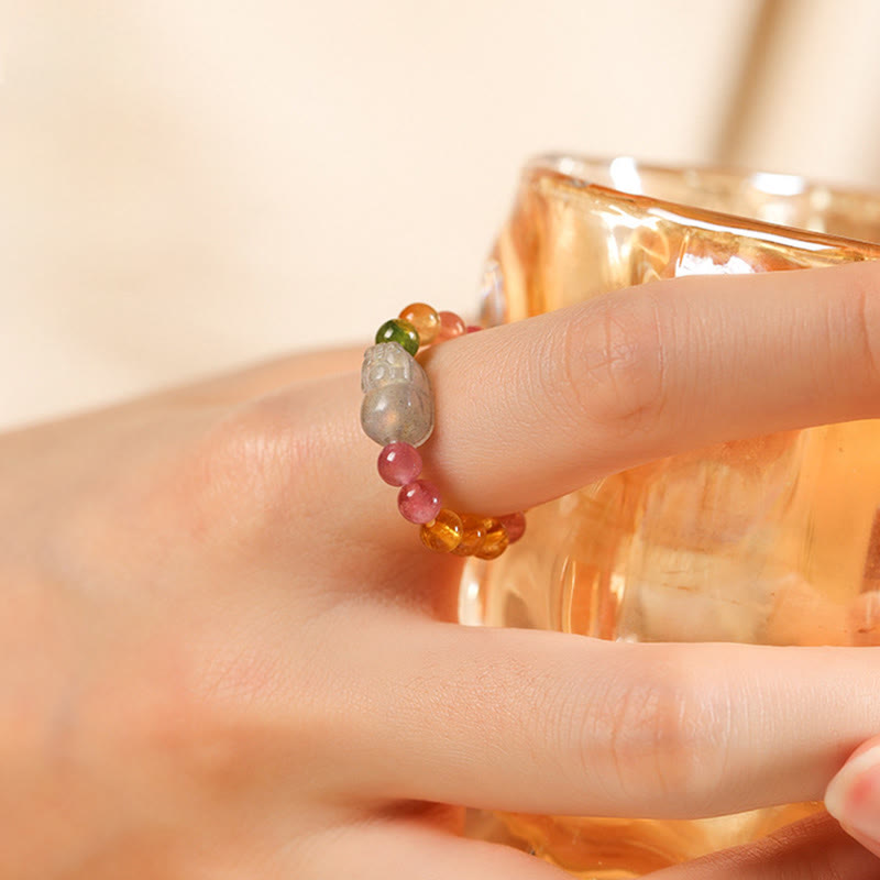 Tourmaline Pearl Amber Pixiu Ring – on finger amber glass background pixiu forward, good fortune jewelry