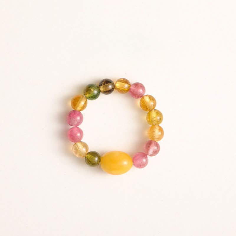 Tourmaline Pearl Amber Pixiu Ring – yellow amber bead center top view white background, amber healing ring