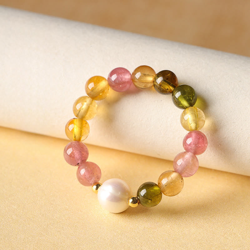 Tourmaline Pearl Amber Pixiu Ring – side angle cream fabric glossy tourmaline beads pearl accent, good luck ring