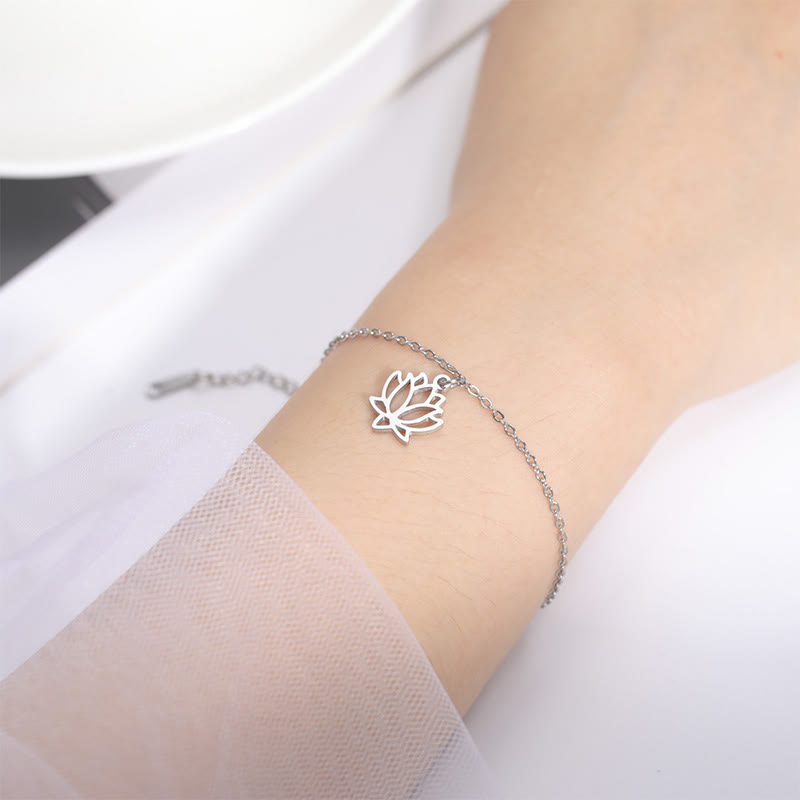 Lotus Titanium Steel Bracelet – silver lotus pendant on wrist with lace, lifestyle
