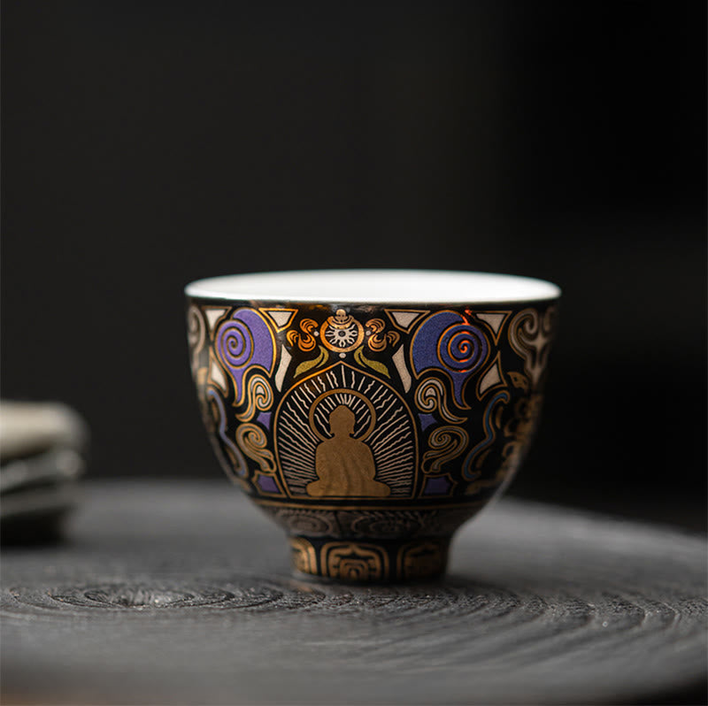 Black Thangka Buddha Kung Fu Tea Cup – front view on stone tea tray with blurred teaware background, zen tea setting