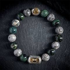 Grey Jasper Om Mani Padme Hum Formless Buddha Bracelet – flatlay black slate circle of patterned grey green beads, flatlay