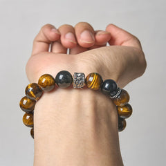 Tiger Eye Silver Sheen Obsidian Buddha Bracelet – on wrist white background tiger eye obsidian silver Buddha, model-wear