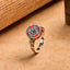 Copper Prayer Wheel Ring - Side angle showing red enamel medallion with dark bezel stone, rotatable prayer ring