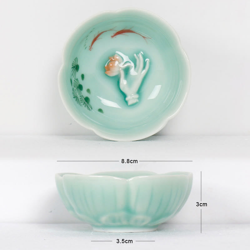 Koi Fish & Lotus Tea Cup – 3D fish relief with peach and pine motifs inside, ceramic tea cup