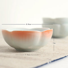 Koi Fish & Lotus Tea Cup – Side profile with peach-coral gradient and lotus petal rim, ceramic cup