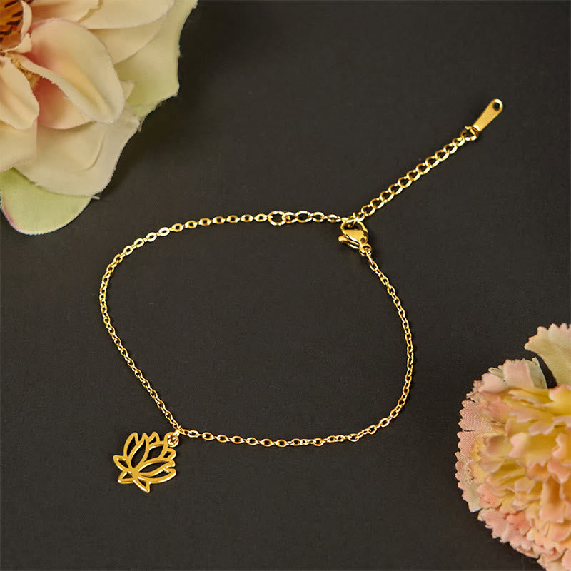 Lotus Titanium Steel Bracelet – gold openwork lotus charm on dark, balance