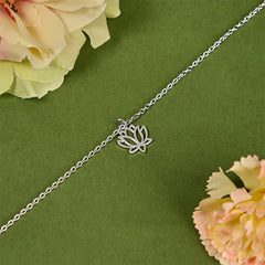 Lotus Titanium Steel Bracelet – silver lotus charm diagonal view on green, spiritual