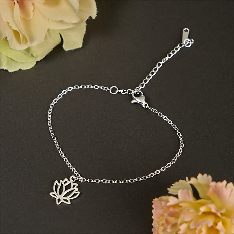 Lotus Titanium Steel Bracelet – silver openwork lotus charm flat lay, titanium steel