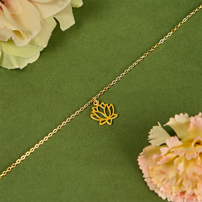 Lotus Titanium Steel Bracelet – gold lotus charm diagonal view on green, spiritual