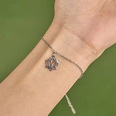 Lotus Titanium Steel Bracelet – silver lotus charm worn on wrist, close-up