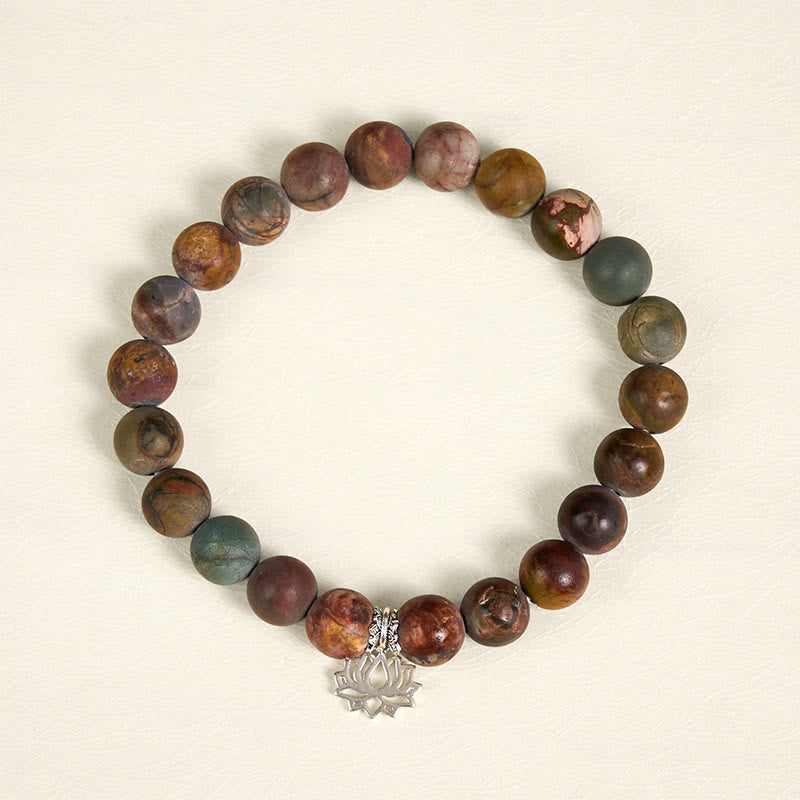 Picasso Jasper Lotus Bracelet – overhead view of multicolor jasper beads with silver lotus charm, natural stone