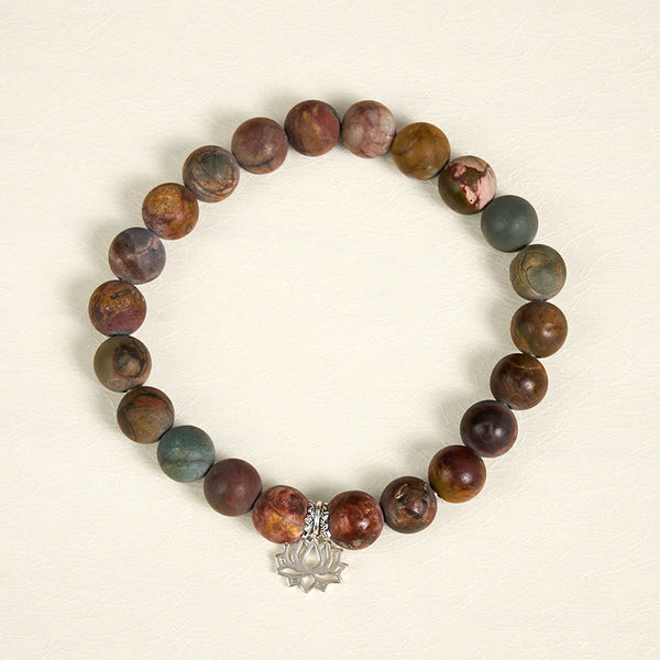 Picasso Jasper Lotus Bracelet – overhead view of multicolor jasper beads with silver lotus charm, natural stone