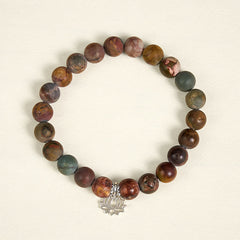 Picasso Jasper Lotus Bracelet – overhead view of multicolor jasper beads with silver lotus charm, natural stone